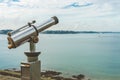 Coin telescope facing sea