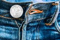 Trx coin instead of buttons on jeans.
