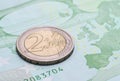 Coin two euros on the banknote of one hundred euro Royalty Free Stock Photo