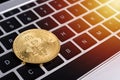 Coin, virtual golden bitcoin money on keyboard laptop computer, Royalty Free Stock Photo