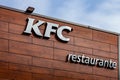 KFC lettering on the facade of a Kentuky Fried Chicken fast food restaurant.