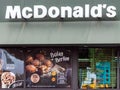 Coina, Portugal - October 23, 2019: Storefront of the McDonalds restaurant and McCafe advertising a sweet pastry called Bolas de