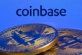 Coinbase logo and Bitcoins