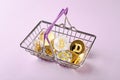 Coins, altcoins and bitcoins in shopping basket, sales and shopping, cryptocurrencies exchange concept