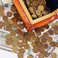 Coins and banknotes in the box Royalty Free Stock Photo