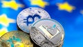 Coins Bitcoin and litecoin, against the background of Europe and the European flag, the concept of virtual money, close-up. Royalty Free Stock Photo