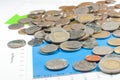 Coins on blue green graphs and charts background. money and fina Royalty Free Stock Photo