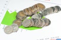 Coins on blue green graphs and charts background. money and fina Royalty Free Stock Photo