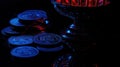 Coins, bowl, dark, red, blue, lighting, reflection, finance Royalty Free Stock Photo