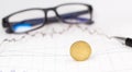 Coins, calculator and glasses on growth financial graph, Royalty Free Stock Photo