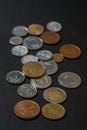 A scattering of coins on a black background Royalty Free Stock Photo