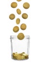 Coins falling into glass jar on white background Royalty Free Stock Photo