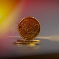 Coins of fifty euro cents lie on a pile of coins. Coins on the b Royalty Free Stock Photo