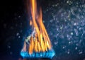 Coins on fire. The concept of high prices for natural gas. Royalty Free Stock Photo