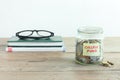 Coins in jar with College Fund label Royalty Free Stock Photo