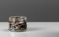 Coins in glass jar. currency money on dark gray background for business and finance concept Royalty Free Stock Photo