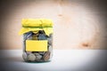 Coins in a glass jar Royalty Free Stock Photo