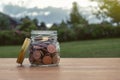 Coins in glass jar for money saving financial concept.Saving money for investing and for the future