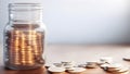 Coins in a glass jar on a wooden table with copy space, retirement concept Royalty Free Stock Photo