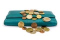 Coins and green female wallet isolated on a white background. Close-up. Royalty Free Stock Photo