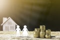 Coins house and family. Royalty Free Stock Photo