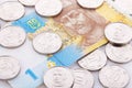 Coins 10 hryvnia lie on the banknote denomination in 1 gris. Close-up