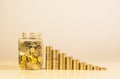 Coins in jar with money stack step growing money Royalty Free Stock Photo