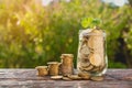 Coins in jar with money stack step growing money, Concept finance business and saving investment. Royalty Free Stock Photo