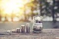 Coins in jar with money stack step growing. Royalty Free Stock Photo