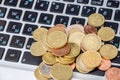 Coins on laptop keyboard close-up. Business concept. Royalty Free Stock Photo