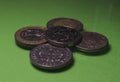 Coins macro shot on a green background. Finance, money in the form of coins close-up Royalty Free Stock Photo