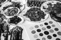 Coins, medals, badges and seeds at a table. The text in the poster means `Bank of Lebanon` [Black and White version] Royalty Free Stock Photo