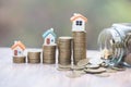 Coins money setting growth up increase to house model for concept investment mortgage finance and home loan business, business, Royalty Free Stock Photo