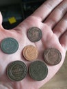 Coins on the open left palm