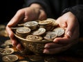 Coins in palms of woman hands over black background. Financial growth, saving money, investment concept Royalty Free Stock Photo