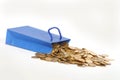 Coins and paper gift bag Royalty Free Stock Photo
