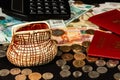 Coins and paper money and two international passports lie on a black wooden table Royalty Free Stock Photo