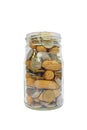 Coins and peanuts in glass jar Royalty Free Stock Photo