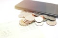 Coins and phone on account book bank for finance and banking. Business concept Royalty Free Stock Photo