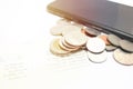 Coins and phone on account book bank for finance and banking. Business concept Royalty Free Stock Photo