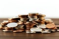 Coins pile, white background, selective focus emphasizes savings concept