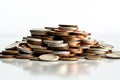 Coins pile, white background, selective focus emphasizes savings concept