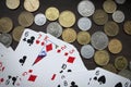 Coins and playing cards top view Royalty Free Stock Photo