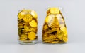 coins, saving gold in a glass bottle Real estate, high value assets, mutual funds, wealth, financial prosperity and