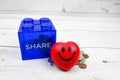 Coins in share savings jar, coins, smiling face expression, Charity and giving money to people is such a kind thing. Donate Give