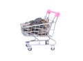 Coins in shopping cart. Royalty Free Stock Photo