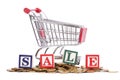 Coins, shopping cart and word SALE Royalty Free Stock Photo