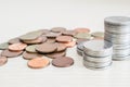 Coins stacked same tower on desk Royalty Free Stock Photo