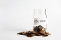 Coins stacked up next to an empty jar with a label on for pension fund. Pension, financial, savings, economy, investment concept Royalty Free Stock Photo