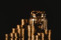 Coins stacks and gold coin money in the glass jar on dark background, for saving for the future banking finance concept. Royalty Free Stock Photo